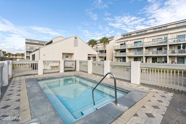 view of pool with fence