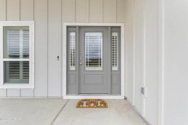 doorway to property with board and batten siding