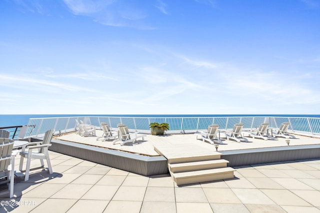 view of patio featuring a water view