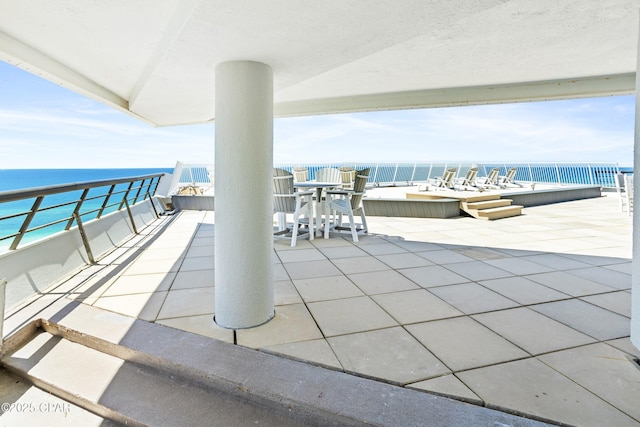 view of patio / terrace featuring a water view