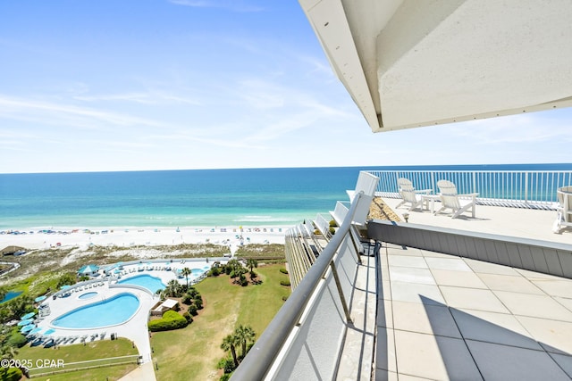 balcony with a view of the beach and a water view