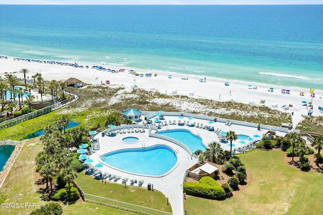 birds eye view of property featuring a view of the beach and a water view