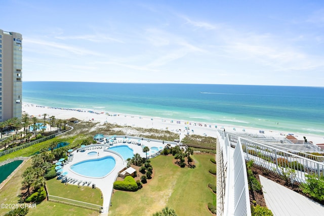 drone / aerial view featuring a view of the beach and a water view