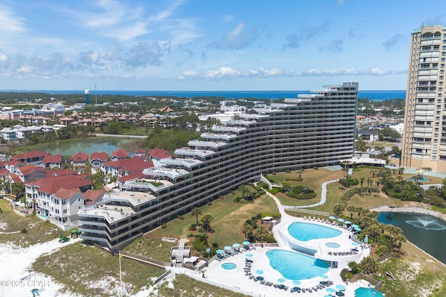 drone / aerial view featuring a water view and a city view