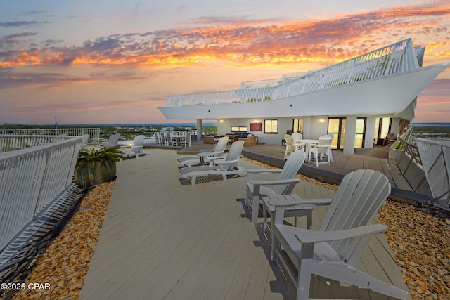 patio terrace at dusk with outdoor dining space