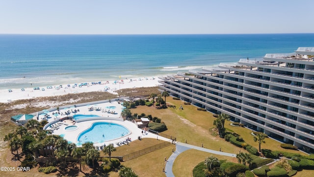 drone / aerial view featuring a water view and a beach view