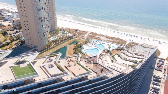 bird's eye view featuring a water view and a view of the beach