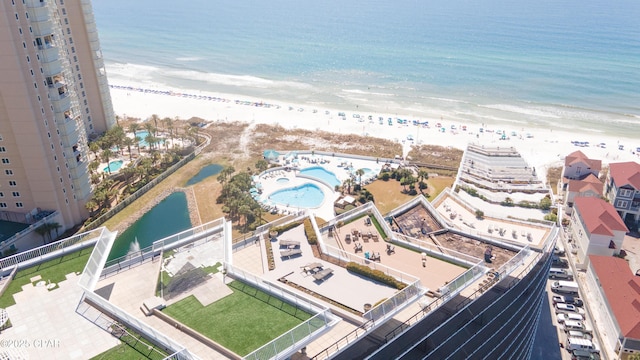 birds eye view of property featuring a water view and a view of the beach