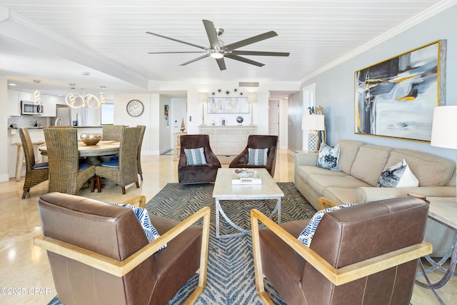 living area with visible vents, baseboards, ornamental molding, light tile patterned flooring, and a ceiling fan