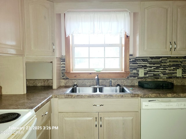 kitchen featuring a sink, backsplash, and white dishwasher