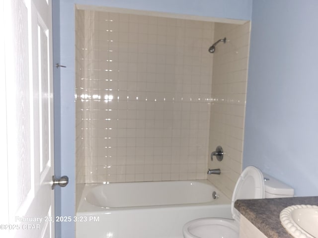 full bathroom with shower / bathing tub combination, toilet, and vanity