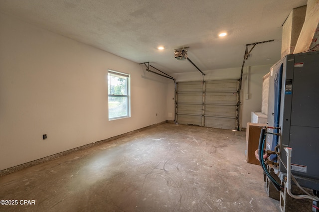 garage featuring a garage door opener and baseboards