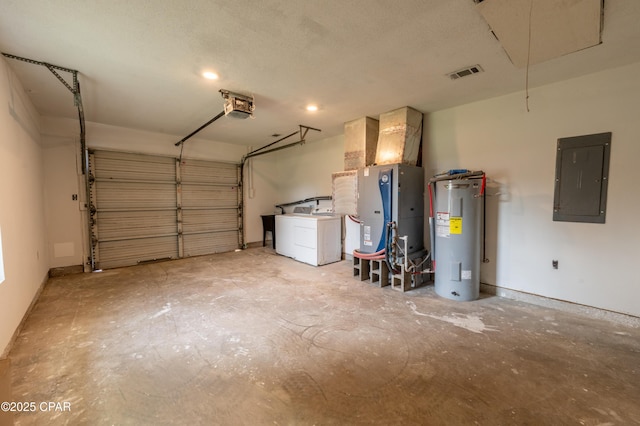 garage featuring visible vents, electric water heater, electric panel, washer / dryer, and a garage door opener