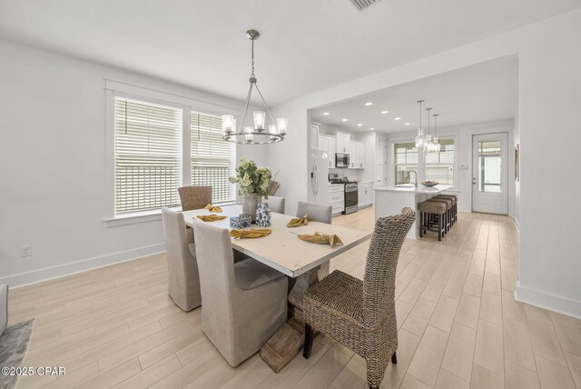 2009 Calamint St, Panama City, FL 32405 - dining room with a chandelier, light wood finished floors, baseboards, and recessed lighting