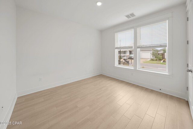 2009 Calamint St, Panama City, FL 32405 - unfurnished room featuring light wood-type flooring, baseboards, and recessed lighting