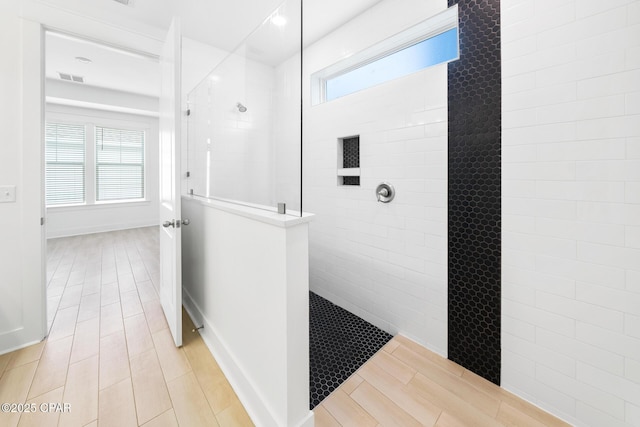 full bathroom with visible vents and a walk in shower