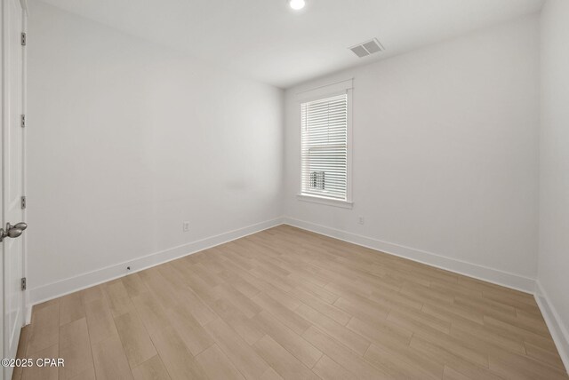 2009 Calamint St, Panama City, FL 32405 - spare room with baseboards, light wood-style flooring, and recessed lighting
