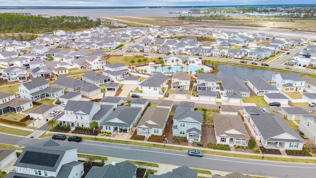 birds eye view of property featuring a residential view and a water view