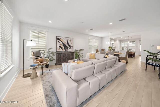 2009 Calamint St, Panama City, FL 32405 - living area featuring a chandelier, light wood-style floors, recessed lighting, and baseboards