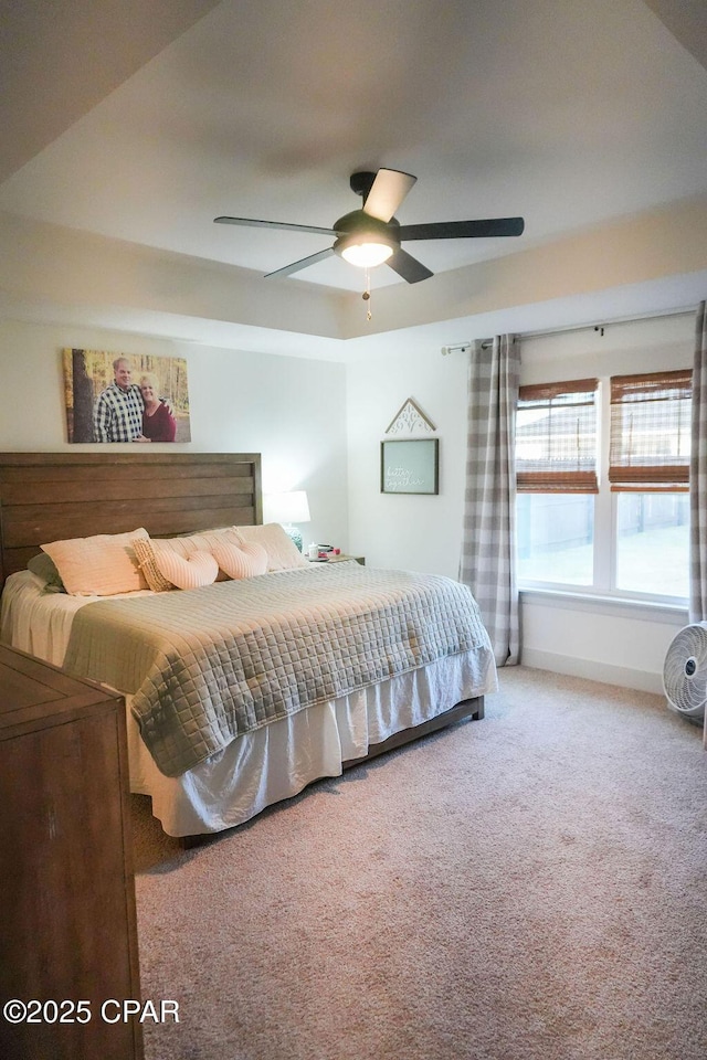 bedroom featuring carpet flooring, baseboards, and ceiling fan