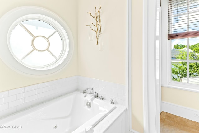 239 Sand Oaks Cir, Santa Rosa Beach, FL 32459 - bathroom with tile patterned flooring and a garden tub