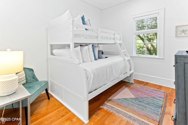 239 Sand Oaks Cir, Santa Rosa Beach, FL 32459 - bedroom with baseboards and wood finished floors