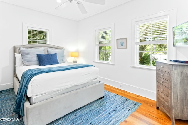 239 Sand Oaks Cir, Santa Rosa Beach, FL 32459 - bedroom with ceiling fan, baseboards, and wood finished floors