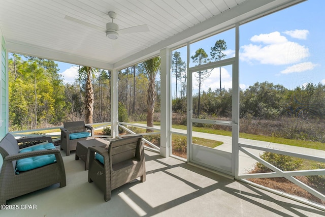 sunroom with a ceiling fan