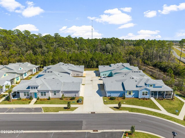 aerial view with a view of trees and a residential view