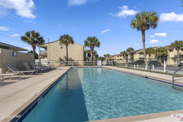 pool featuring a patio and fence