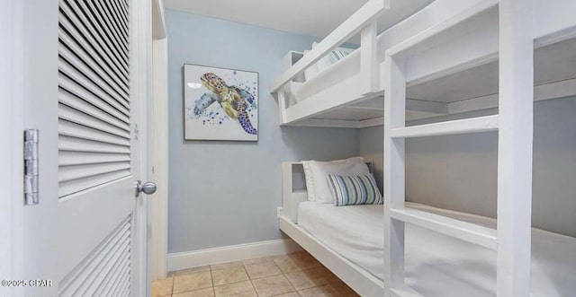 tiled bedroom with baseboards