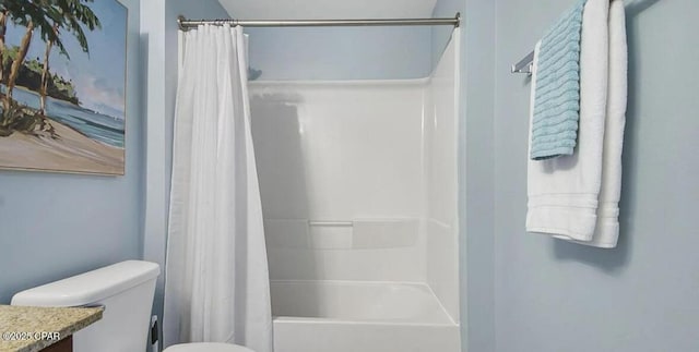 bathroom featuring vanity, shower / bath combination with curtain, and toilet