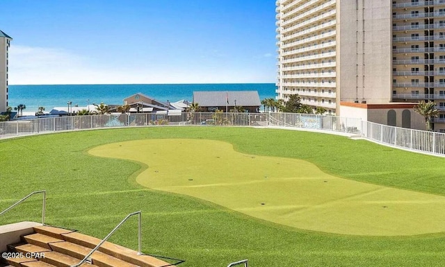 surrounding community featuring fence and a water view