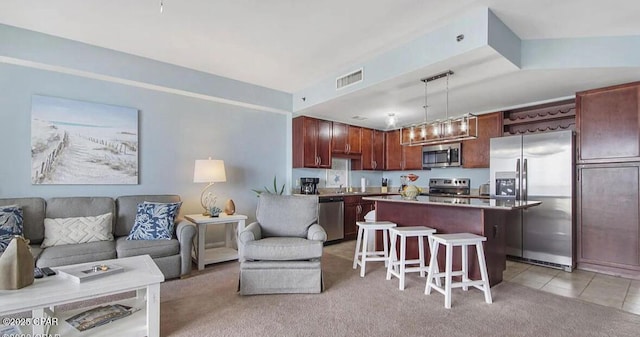 living area with light tile patterned flooring, light colored carpet, and visible vents