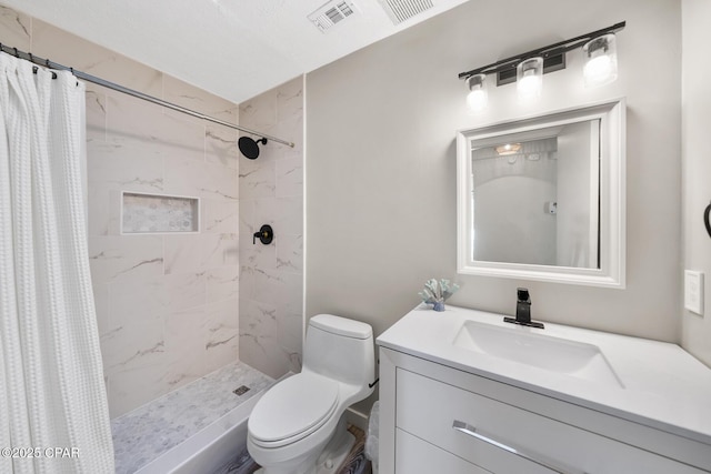 full bathroom featuring visible vents, a stall shower, toilet, and vanity