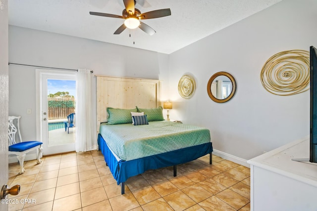 bedroom featuring baseboards, light tile patterned flooring, a textured ceiling, a ceiling fan, and access to outside