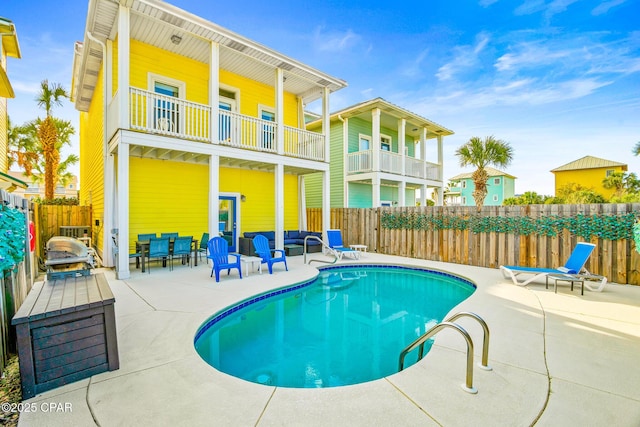 view of pool featuring a fenced in pool, a patio, and a fenced backyard