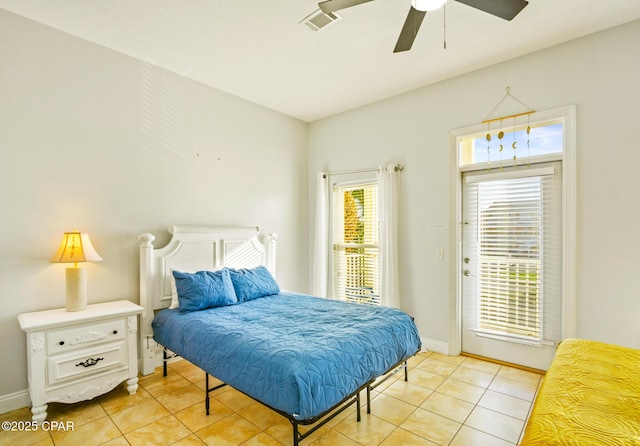 bedroom featuring access to exterior, visible vents, ceiling fan, baseboards, and light tile patterned floors