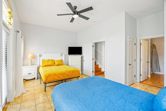 bedroom featuring light tile patterned floors and a ceiling fan