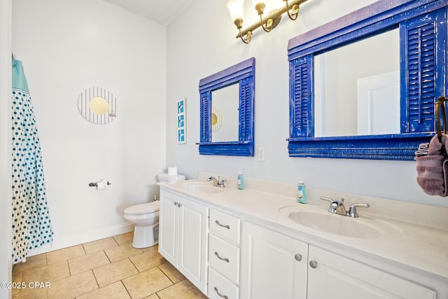 full bathroom with a sink, toilet, double vanity, and tile patterned floors