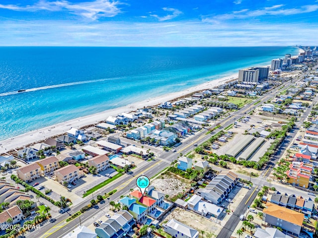 birds eye view of property with a view of the beach and a water view