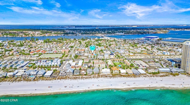 drone / aerial view with a beach view and a water view