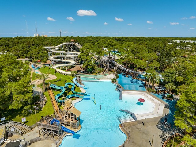 birds eye view of property featuring a wooded view