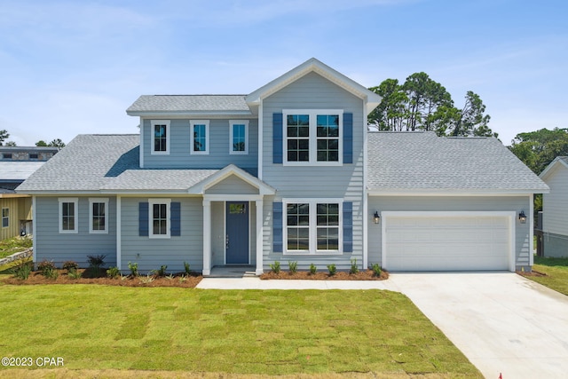 view of front of home featuring a front yard, driveway, a garage, and a shingled roof
