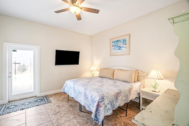 bedroom with light tile patterned floors, a ceiling fan, and baseboards