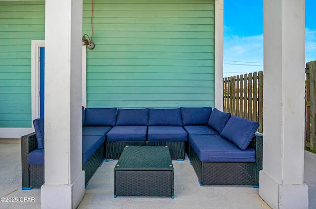 view of patio / terrace featuring an outdoor hangout area and fence