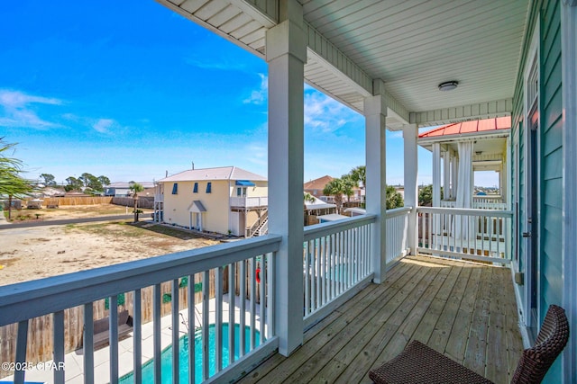 wooden terrace featuring a residential view