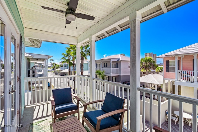 balcony with a ceiling fan and a residential view