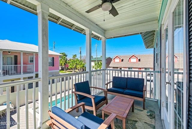 balcony with outdoor lounge area and a ceiling fan