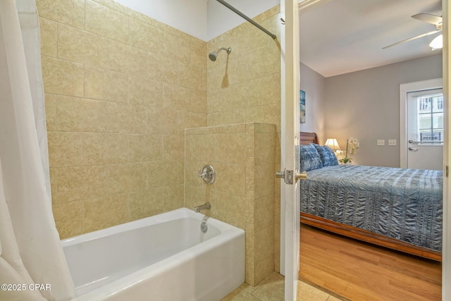 ensuite bathroom with a ceiling fan, shower / tub combo, wood finished floors, and ensuite bathroom